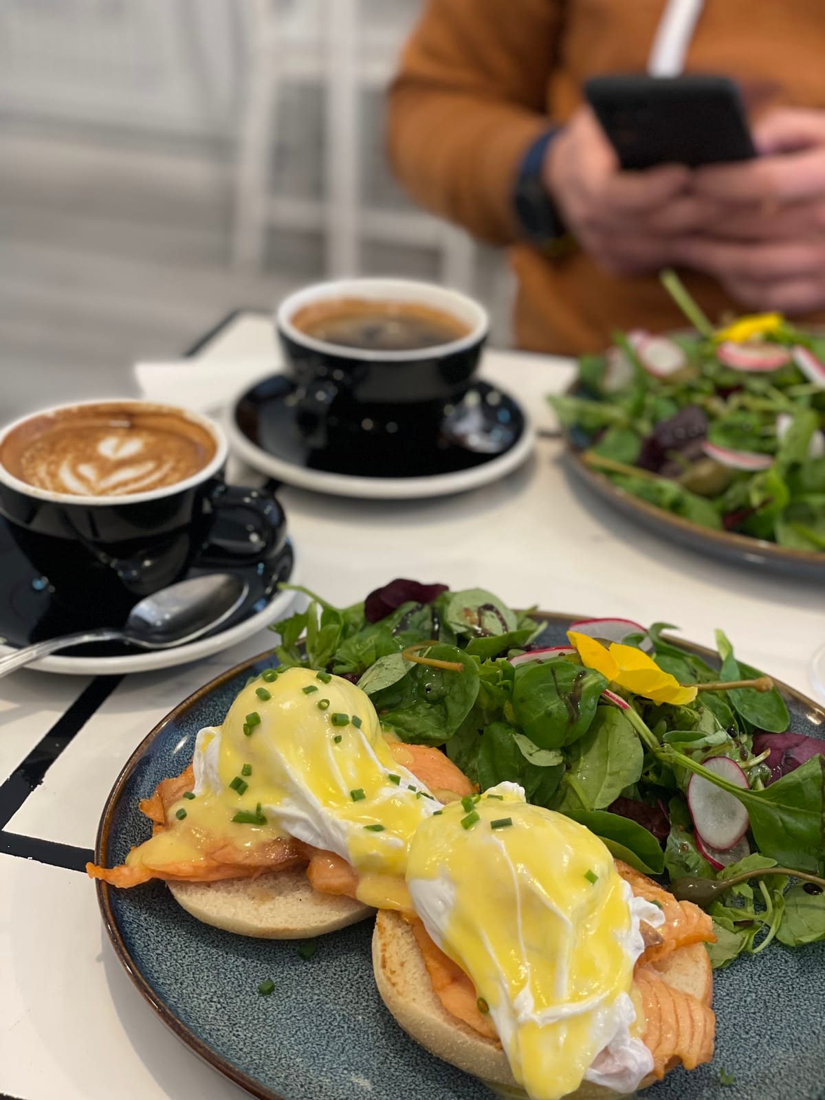 Eggs Royale — poached eggs with salmon and hollandaise, with salad